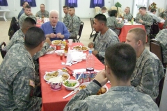 Senator John McCain sharing lunch with service members in Iraq, 2006